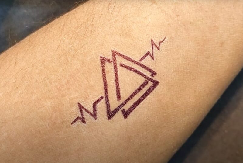 triangle tatoo on hand
